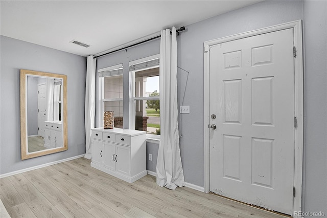 5813 Ceylon St, Denver, CO 80249 - entrance foyer featuring light wood-style flooring and baseboards