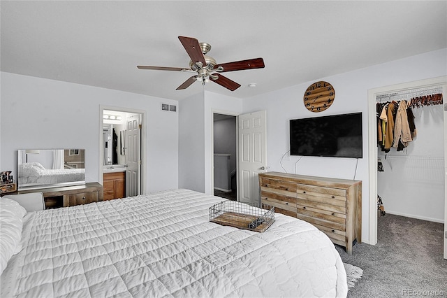 5813 Ceylon St, Denver, CO 80249 - carpeted bedroom featuring a spacious closet, a closet, a ceiling fan, and connected bathroom