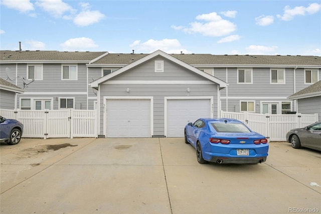 5813 Ceylon St, Denver, CO 80249 - townhome / multi-family property featuring driveway and a gate