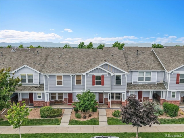 5813 Ceylon St, Denver, CO 80249 - multi unit property with brick siding, board and batten siding, a porch, and a shingled roof