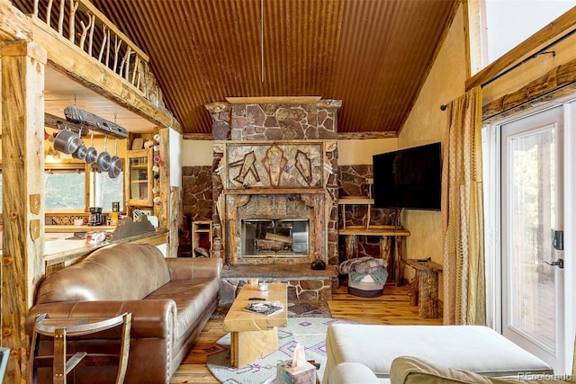 living room featuring a fireplace, hardwood / wood-style flooring, vaulted ceiling, and wooden ceiling