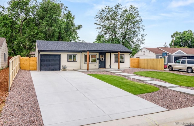 3061 S Glencoe St, Denver, CO 80222 - ranch-style house featuring an attached garage, driveway, and covered porch
