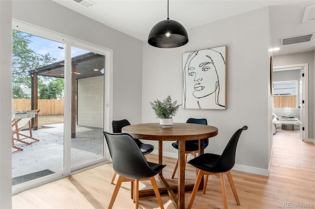 3061 S Glencoe St, Denver, CO 80222 - dining space with light wood-type flooring and baseboards