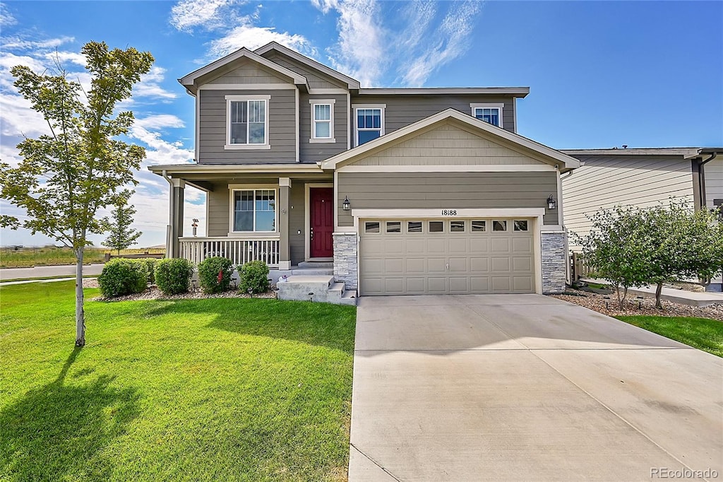 craftsman-style house with a porch, a front yard, and a garage