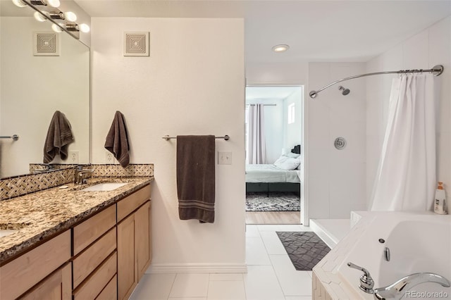 bathroom featuring independent shower and bath, vanity, and tile patterned flooring