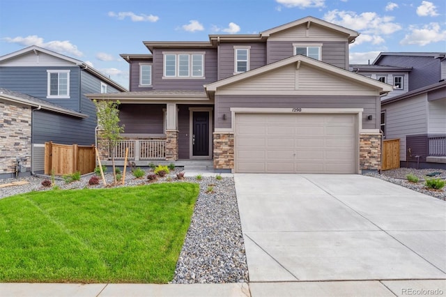 1290 Loraine Cir N, Lafayette, CO 80026 - craftsman-style house with covered porch, a garage, concrete driveway, and stone siding
