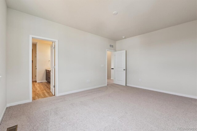 1290 Loraine Cir N, Lafayette, CO 80026 - unfurnished bedroom with light carpet and connected bathroom