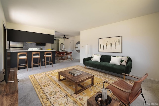 living room with carpet and a ceiling fan