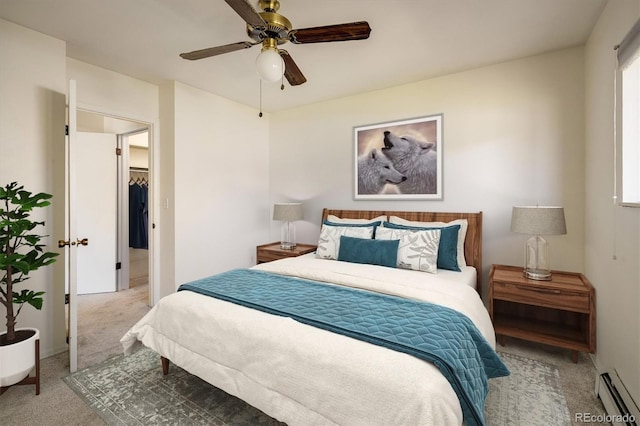 bedroom featuring baseboard heating, a ceiling fan, and carpet floors