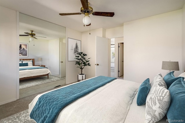 carpeted bedroom with baseboards and a ceiling fan