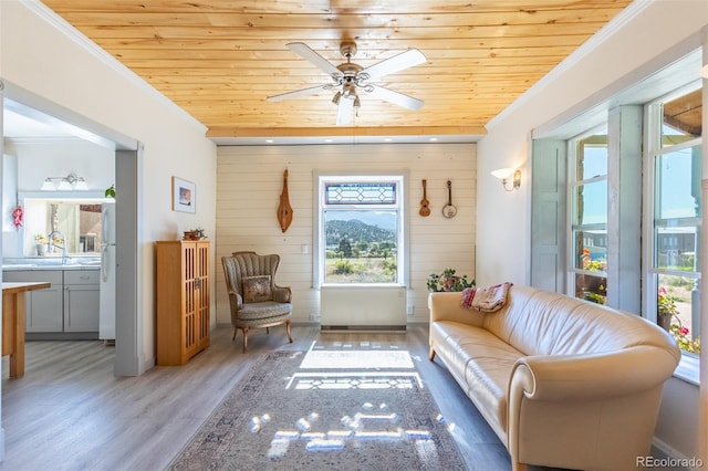 689 County Road 4, Howard, CO 81233 - sitting room featuring crown molding, wood ceiling, wood finished floors, wood walls, and ceiling fan