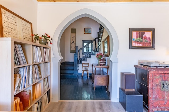 689 County Road 4, Howard, CO 81233 - hall featuring wood finished floors, ornamental molding, arched walkways, and stairway