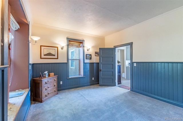689 County Road 4, Howard, CO 81233 - carpeted bedroom featuring a wainscoted wall and ornamental molding
