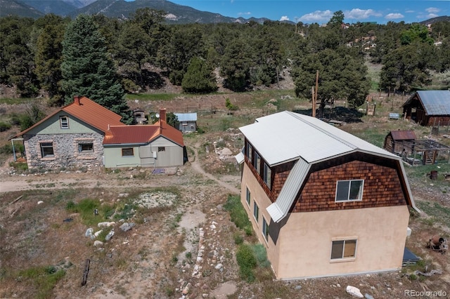 689 County Road 4, Howard, CO 81233 - view from above of property featuring mountains and a heavily wooded area