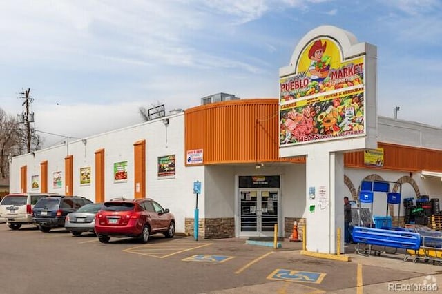 view of commercial property with uncovered parking