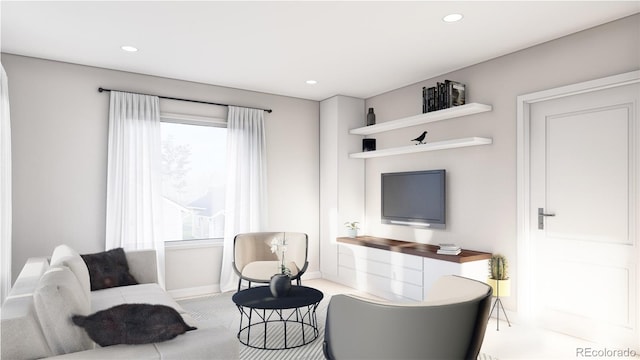 living room featuring baseboards and recessed lighting