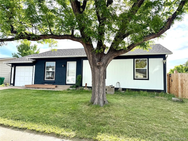 4312 S Xenon St, Morrison, CO 80465 - view of front facade with an attached garage, a shingled roof, and driveway