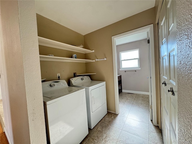 4312 S Xenon St, Morrison, CO 80465 - laundry room featuring washing machine and dryer, light tile patterned flooring, and baseboards