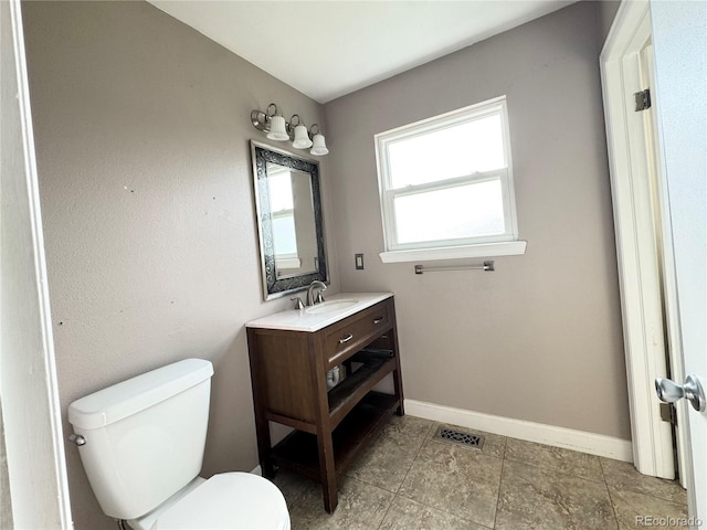 4312 S Xenon St, Morrison, CO 80465 - bathroom with toilet, vanity, and baseboards