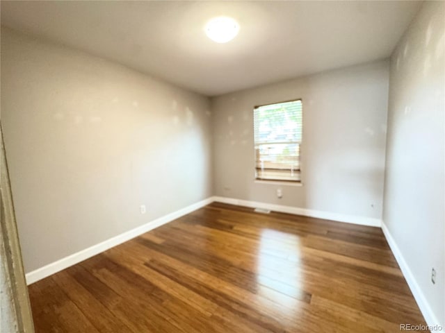 4312 S Xenon St, Morrison, CO 80465 - unfurnished room featuring wood finished floors and baseboards