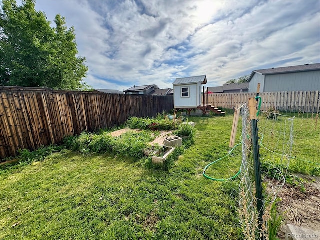 4312 S Xenon St, Morrison, CO 80465 - view of yard featuring a vegetable garden