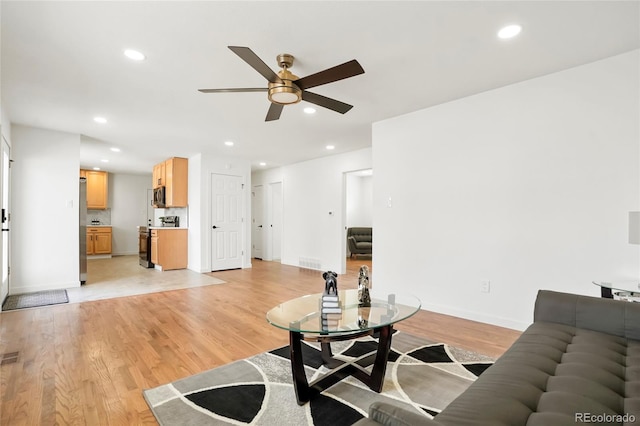 9101 Clarkson St, Thornton, CO 80229 - living area with a ceiling fan, light wood finished floors, recessed lighting, and baseboards