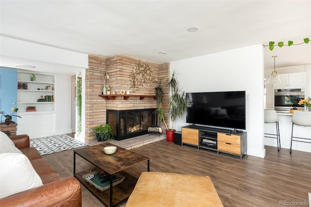 2250 N Monaco Pkwy, Denver, CO 80207 - living area with wood finished floors and a fireplace