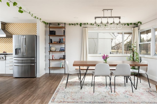 2250 N Monaco Pkwy, Denver, CO 80207 - dining space with dark wood-style flooring and baseboards