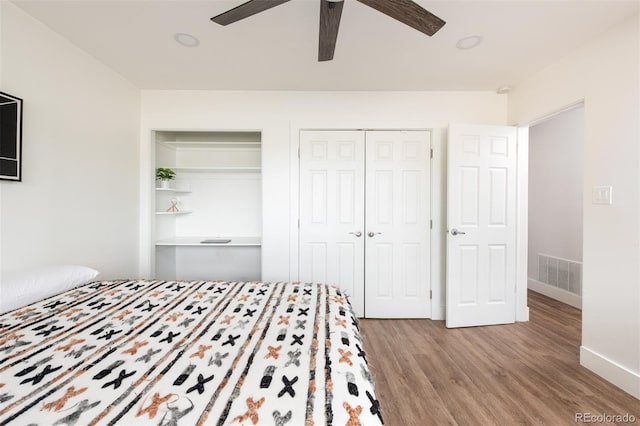 2250 N Monaco Pkwy, Denver, CO 80207 - bedroom featuring wood finished floors and ceiling fan