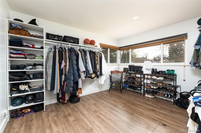 2250 N Monaco Pkwy, Denver, CO 80207 - spacious closet featuring wood finished floors