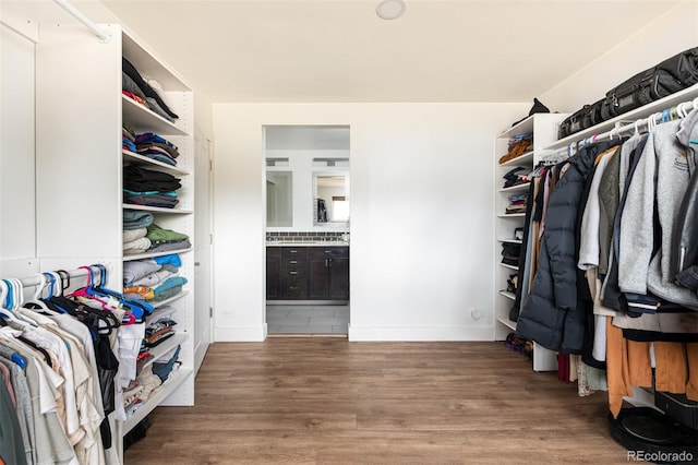 2250 N Monaco Pkwy, Denver, CO 80207 - spacious closet featuring wood finished floors