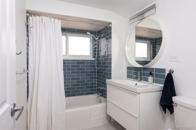 2250 N Monaco Pkwy, Denver, CO 80207 - bathroom with shower / bath combination with curtain, vanity, and backsplash