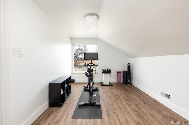 2250 N Monaco Pkwy, Denver, CO 80207 - workout room featuring lofted ceiling and wood finished floors