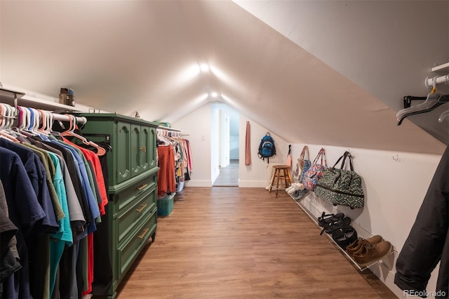 2250 N Monaco Pkwy, Denver, CO 80207 - walk in closet featuring light wood-type flooring and vaulted ceiling