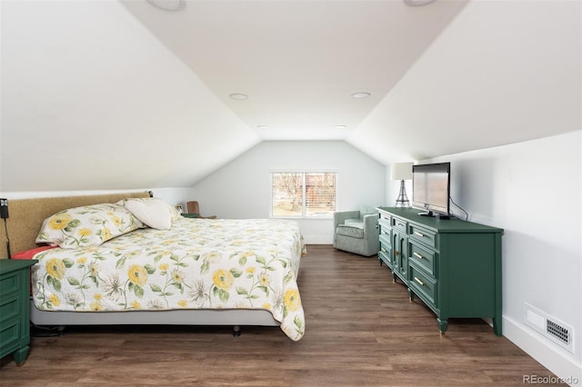 2250 N Monaco Pkwy, Denver, CO 80207 - bedroom with lofted ceiling and dark wood finished floors