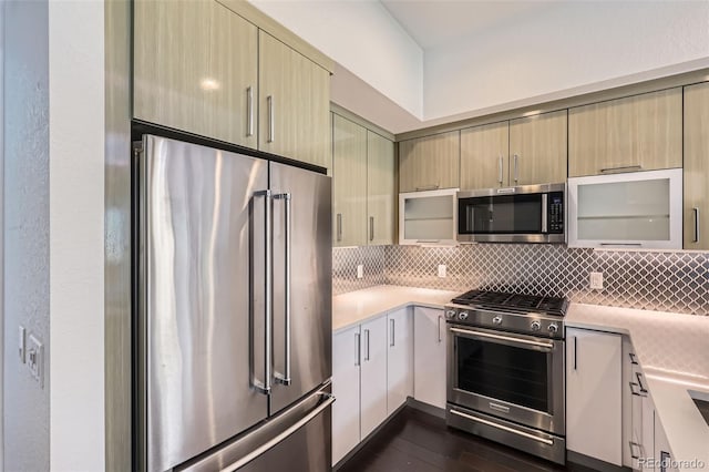 3030 N Wilson Ct Unit 3, Denver, CO 80205 - kitchen featuring high end appliances, light countertops, decorative backsplash, dark wood-style floors, and modern cabinets