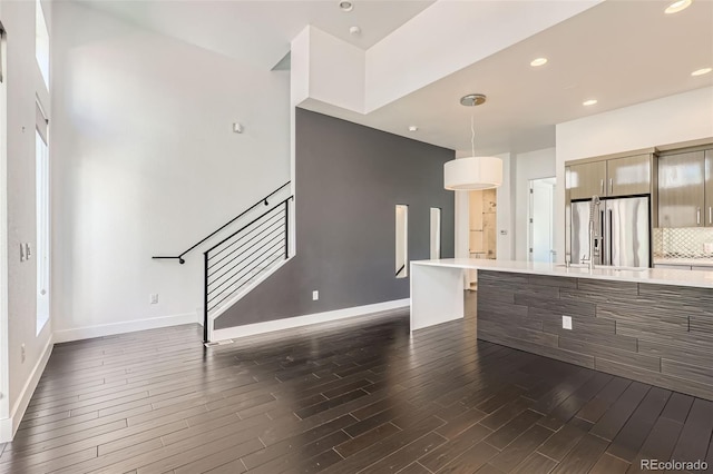 3030 N Wilson Ct Unit 3, Denver, CO 80205 - unfurnished living room with stairway, dark wood-style flooring, and recessed lighting