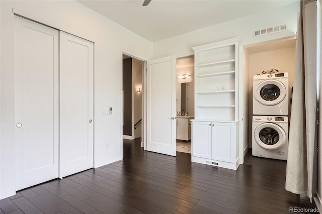3030 N Wilson Ct Unit 3, Denver, CO 80205 - laundry area with stacked washer / dryer and dark wood-type flooring