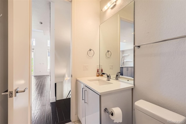 3030 N Wilson Ct Unit 3, Denver, CO 80205 - half bathroom with vanity and wood finished floors