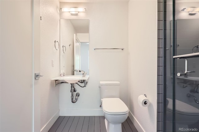3030 N Wilson Ct Unit 3, Denver, CO 80205 - bathroom featuring toilet and a shower stall