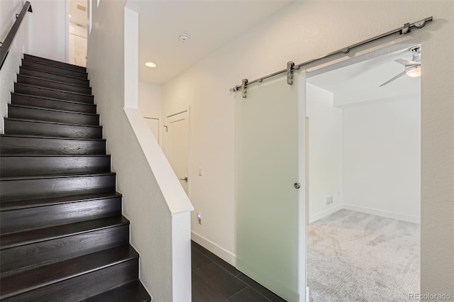3030 N Wilson Ct Unit 3, Denver, CO 80205 - stairway with a barn door and a ceiling fan