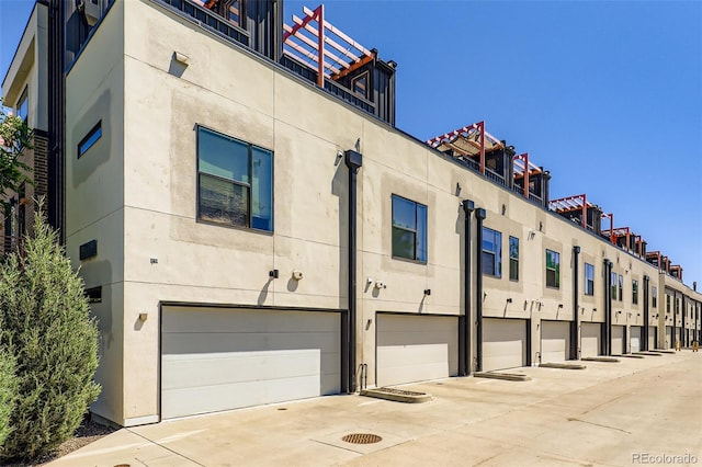 3030 N Wilson Ct Unit 3, Denver, CO 80205 - view of property featuring a garage and concrete driveway