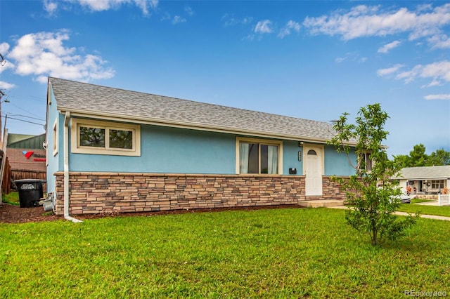 5001 W Nevada Pl, Denver, CO 80219 - single story home with stucco siding, a front lawn, and stone siding