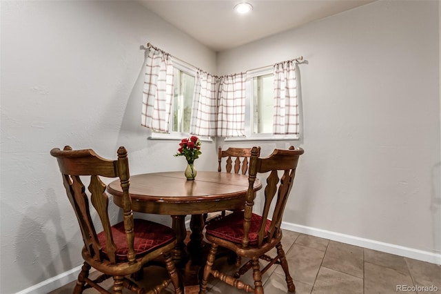 5001 W Nevada Pl, Denver, CO 80219 - dining space with baseboards and tile patterned flooring