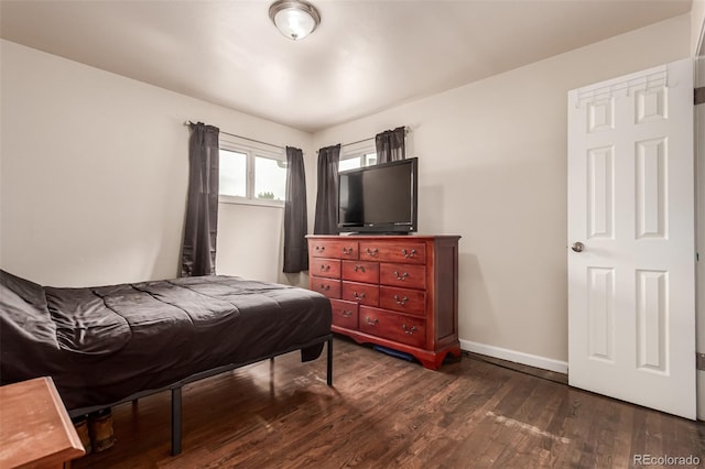 5001 W Nevada Pl, Denver, CO 80219 - bedroom with dark wood-type flooring and baseboards