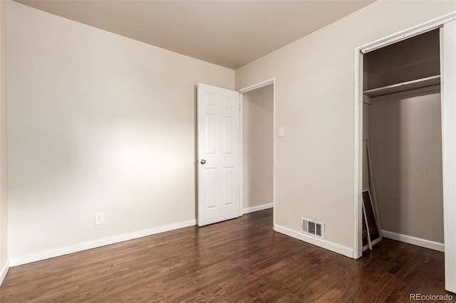 5001 W Nevada Pl, Denver, CO 80219 - unfurnished bedroom featuring dark wood-style floors and a closet