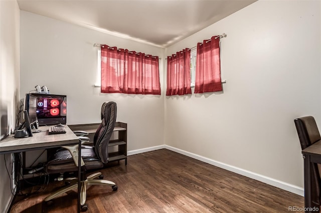 5001 W Nevada Pl, Denver, CO 80219 - home office featuring dark wood-type flooring and baseboards