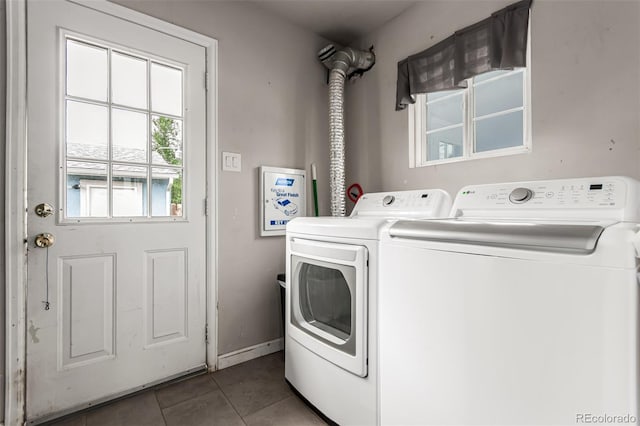 5001 W Nevada Pl, Denver, CO 80219 - washroom featuring washer and dryer and tile patterned floors