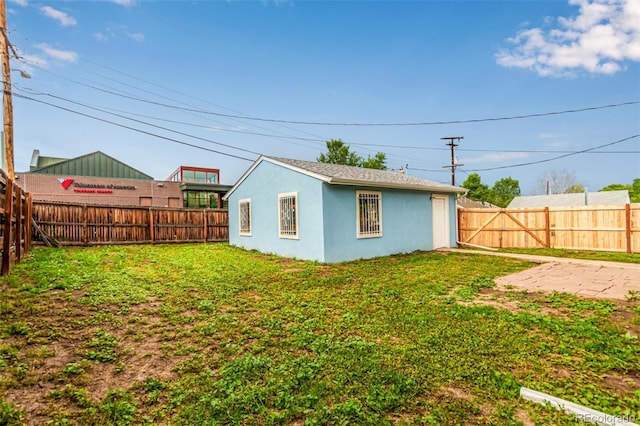 5001 W Nevada Pl, Denver, CO 80219 - view of outbuilding with a fenced backyard