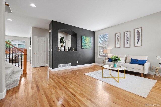 12942 Leyden St, Thornton, CO 80602 - living room featuring healthy amount of natural light, stairway, light wood-style floors, baseboards, and recessed lighting
